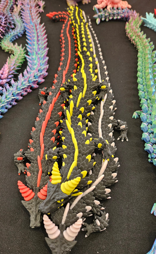 3D printed articulated dragon with multi-colour spines, top view